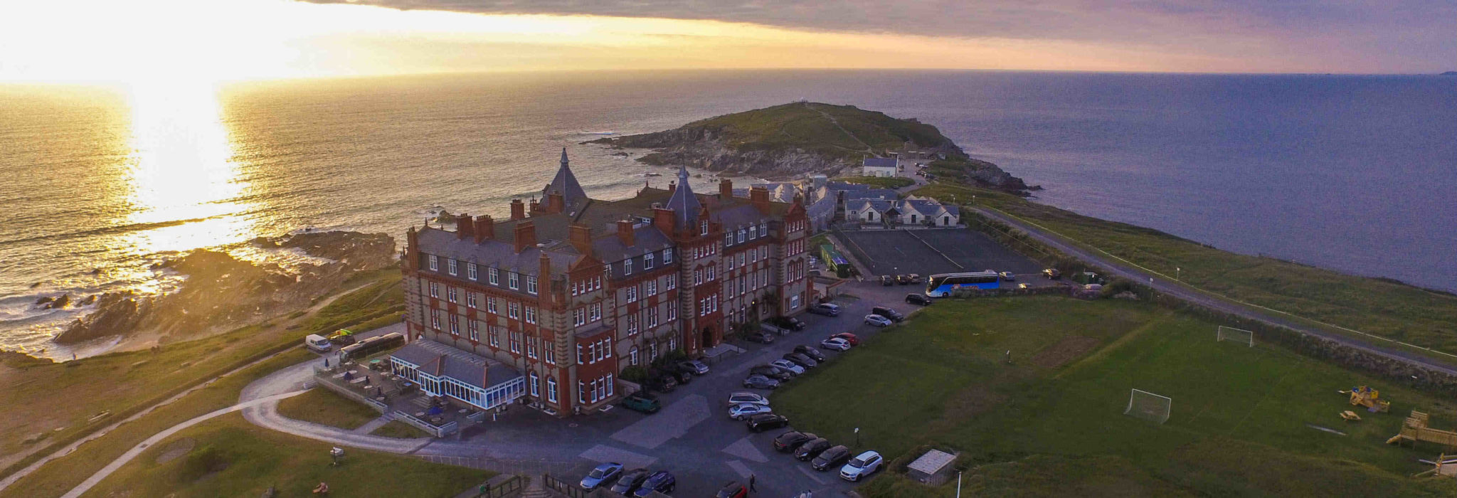 The Headland Hotel from the sky at sunset