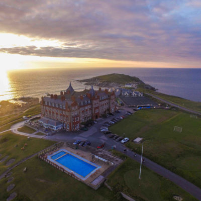 The Headland Hotel from the sky at sunset