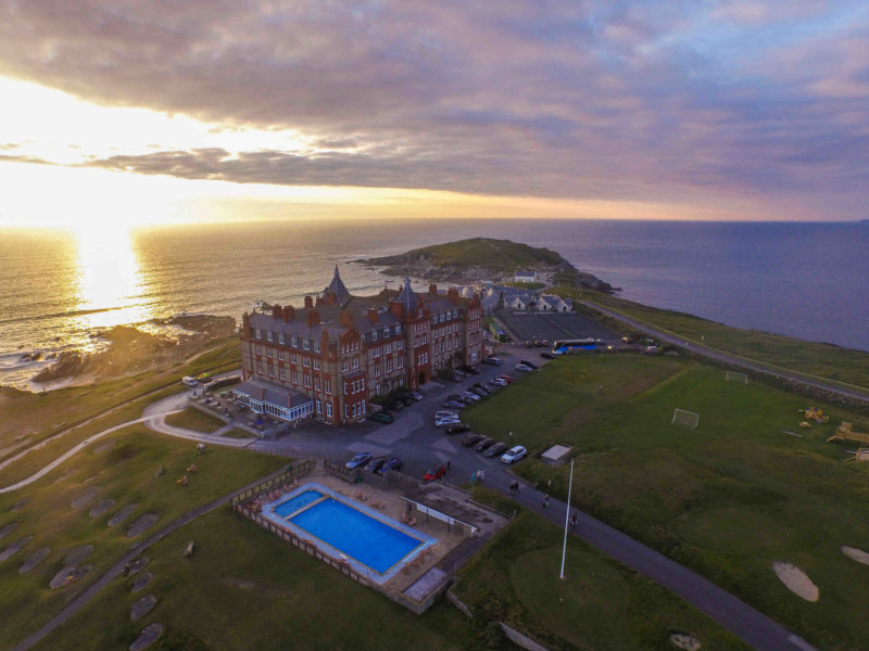 The Headland Hotel from the sky at sunset