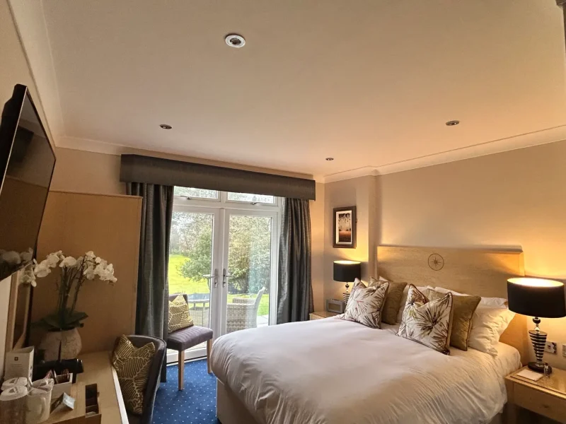 Bedroom with garden doors at The Moorland Country Hotel