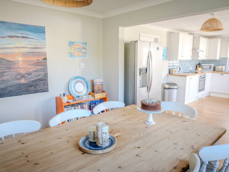Dining area and kitchen at Trecane Beach House, Widemouth Bay
