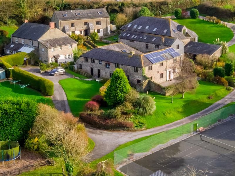 Aerial view of Pitt Farm's barn-conversion cottages, gardens and grounds near Totnes, South Devon