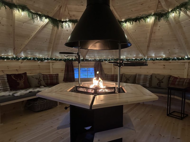 Fire pit and seating inside the BBQ hut at Duvale Barn